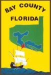 Vintage Bay County, Florida sign with a ship and map illustration.